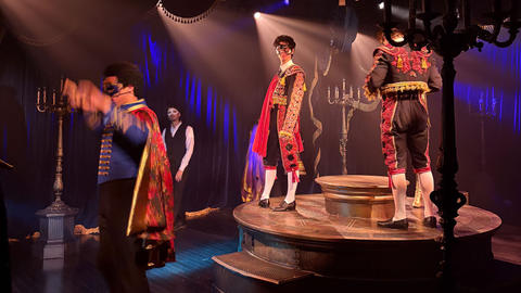 stage production with 3 students in costume