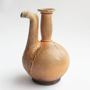 ceramic ewer - a pouring pot with a long vertical spout and neck.