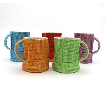 5 ceramic cups that look like they are made of fabric