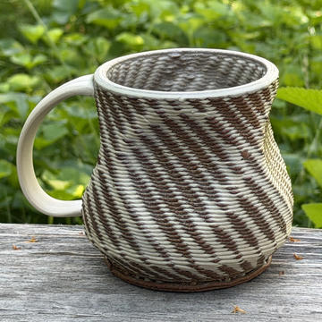 a 3D printed ceramic mug with defined print texture by Nik Putnam