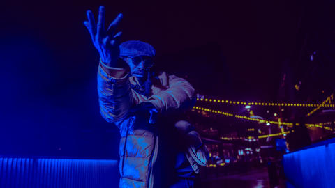 Stiggity Stackz in motion in blue light. 