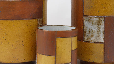 three cylindrical vessels made from slabs