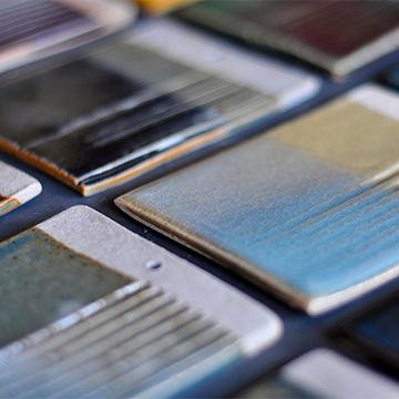 View of test tiles show a variety of glaze colors for ceramics.