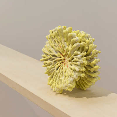 yellow, round sculpture by Yuko Hara